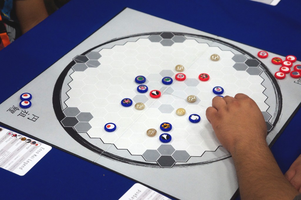 Enso Koi Legend board with koi-themed pieces arranged on the hexagonal pond.